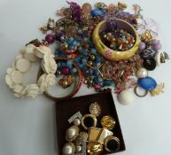 A collection of costume jewellery including vintage costume earrings, bracelets, amethyst necklace