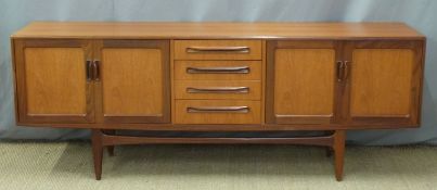 A retro G Plan sideboard comprising four drawers flanked by cupboards, W212 x D47 x H80cm