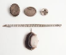 Victorian paste set articulated bracelet, two three Aesthetic style hallmarked silver brooches,