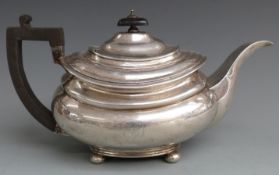 Georgian hallmarked silver teapot raised on four ball feet with ebonised handle, London circa 1830