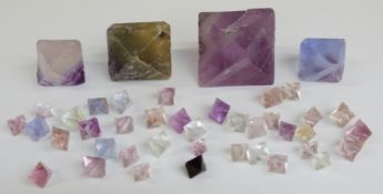 Forty-two rough fluorite gemstones.