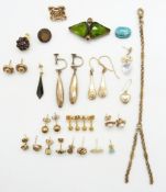 A collection of yellow metal earrings