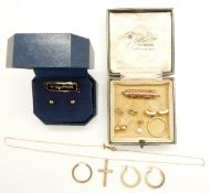 A pair of 9ct gold earrings set with three diamonds to each, a yellow metal ring, a 9ct gold