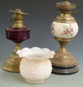 Two 19thC /20thC oil lamps, one with cranberry glass bowl