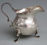 Edward VIII silver jug raised on three feet, Chester 1907 maker George Nathan & Ridley Hayes, height