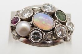 An 18ct white gold ring set with four round cut diamonds, each approximately 0.2ct, six further