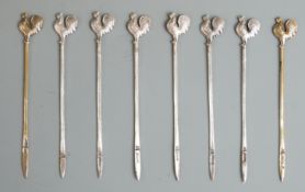 Eight hallmarked silver cockerel cocktail sticks, two being gilt, various dates but all Adie