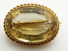 Victorian brooch set with an oval cut citrine within a rope twist border, 4.4g, 2.2 x 1.6cm