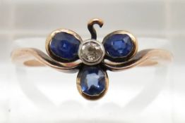 Victorian ring set with three oval sapphires and a diamond in a clover setting, 2.1g, size N