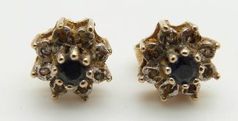 A pair of 9ct gold earrings set with sapphires and diamonds