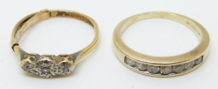 An 18ct gold ring set with diamonds in a platinum setting and a 9ct gold half eternity ring set with