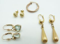 Two pairs of 9ct gold earrings (3.6g), and a pair of 9ct gold earrings set with blue topaz (1.9g)