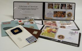 Four various commemorative coin/stamp covers together with a 22ct gold replica 1860 USA stamp and