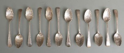 Two sets of six Georgian hallmarked silver teaspoons with shell bowls and bright cut decoration, one