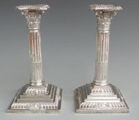 Edward VII pair of silver Corinthian column candlesticks with reeded columns and stepped and