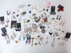 A collection of costume jewellery earrings and silver earrings
