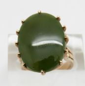 A 9ct gold ring set with a jade style plaque, size K
