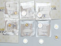 Ten various commemorative miniature gold coins, each weighing 0.5g, some 375 and some 585