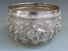 A 19thC Indian / Burmese white metal bowl with relief moulded figural frieze decoration of