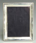 Modern hallmarked silver photograph frame to suit 8x6 inch photo, with blue velvet easel back,
