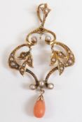 Art Nouveau 9ct gold pendant set with seed pearls and a tear drop coral bead, 5cm long