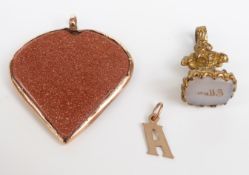 A goldstone/sunstone heart pendant, a Victorian fob set with an intaglio seal and a 9ct gold