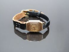 Winegartens 9ct gold ladies wristwatch with gold hands and Arabic numerals, champagne dial and