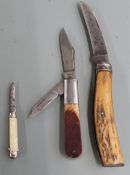 Three vintage penknives, two with horn handles, one stamped Barlow, one with Sayner to blade