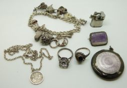 A silver brooch set with amethyst, silver charm bracelet, miniature lighter marked Pygmy Japan,