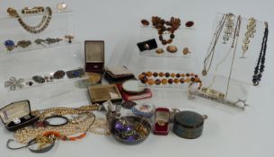 A collection of costume jewellery to include brooches, necklaces, paste necklace, filigree brooch,