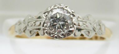 An 18ct gold ring set with a round cut diamond of approximately 0.4ct in a platinum setting, in