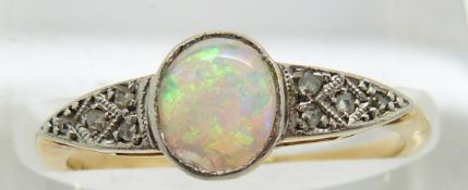Art Deco 18ct gold ring set with an oval opal cabochon and diamonds, 2.1g, size J