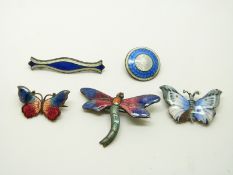 A group of enamel brooches including silver example by JA & S, two butterfly examples, a dragonfly