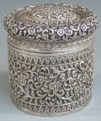 Indian or Burmese white metal lidded trinket or similar pot with finely embossed floral and
