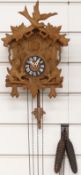 Black Forest mid 20thC cuckoo clock with carved decoration in the form of two squirrels, 30cm tall