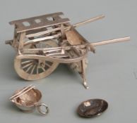 Chinese white metal novelty miniature food or fish cart with basket hanging below and dish of fish