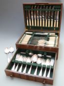 Eight place setting canteen of cutlery in oak case with drawer