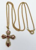 A 9ct gold necklace and a 9ct gold cross set with garnets, 4.3g