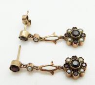 A pair of 9ct gold earrings set with garnets and seed pearls