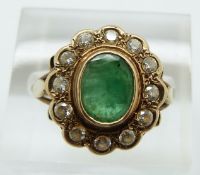 A 9ct gold ring set with an emerald and cubic zirconia, 3.2g, size O