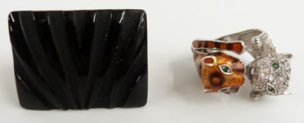 A large designer ring set with carved onyx and a silver ring in the form of two cats or leopards set