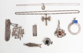 A collection of silver pendants including ingot, retro pendants, silver axe pendant, circular silver