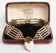 A 9ct gold gate bracelet with a heart padlock clasp, 21g