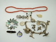 Silver charm bracelet, coral necklace, silver brooch etc.