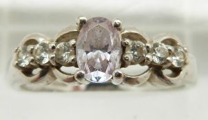 A 14ct white gold ring set with an oval topaz and cubic zirconia, 3.5g, size P