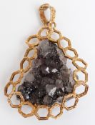A 9ct gold bespoke pendant set with a rough quartz sample by Hooper Bolton, 33.5g (6 x 4.5cm)
