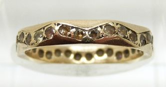 A 9ct gold eternity ring set with paste in a zig zag design, 1.8g, size L