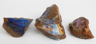 Three large uncut opal boulders.