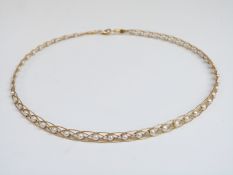 An 18ct gold necklace set with pearls in plaited setting, 10g