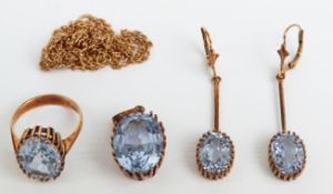 A 14ct gold suite of jewellery set with oval cut aquamarines comprising earrings, pendant and ring